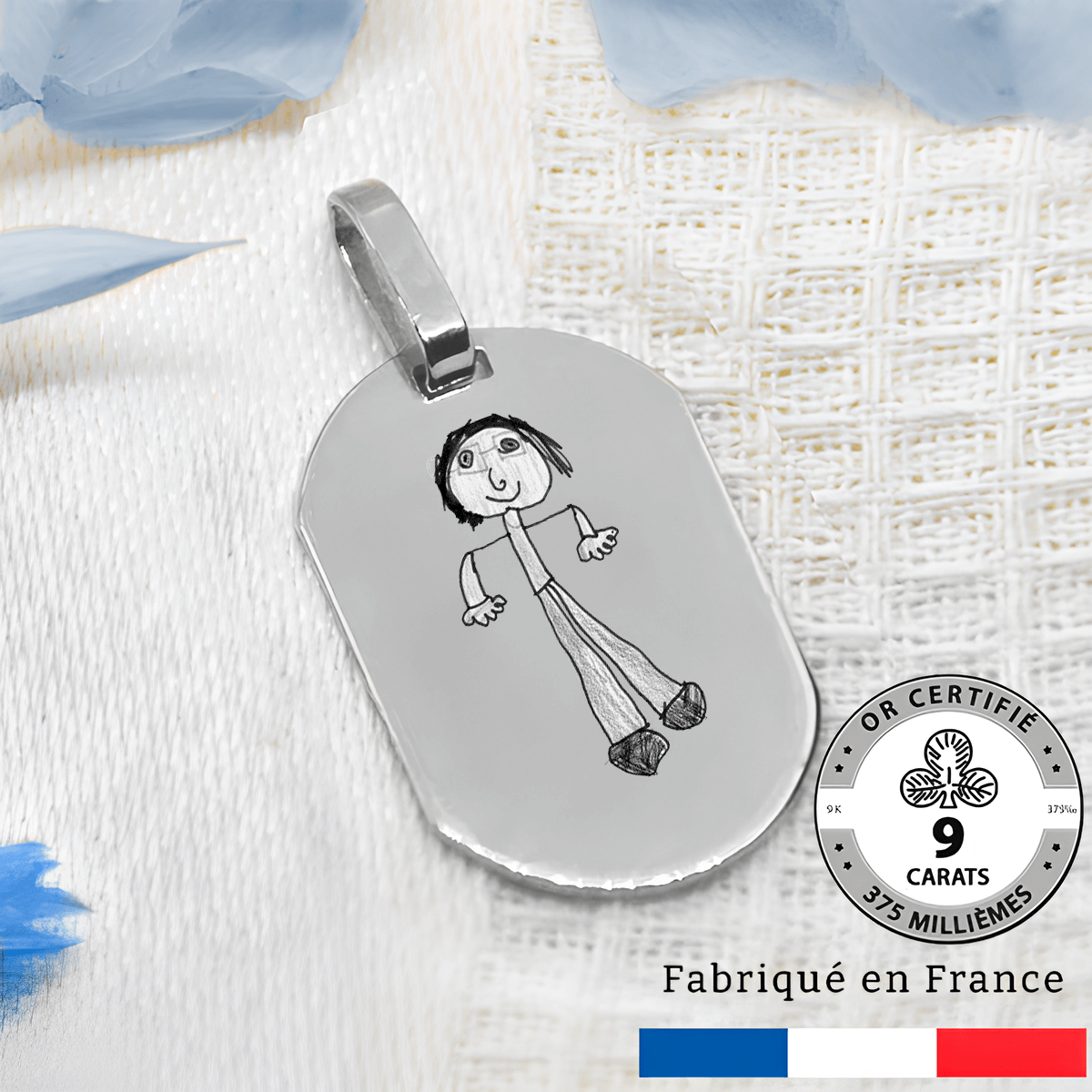 Bijou médaillon tonneau gravé avec un dessin or gris 9 carats.