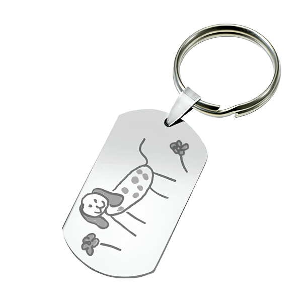 Dessin d'enfant gravé sur un porte-clés métallique en idée cadeau