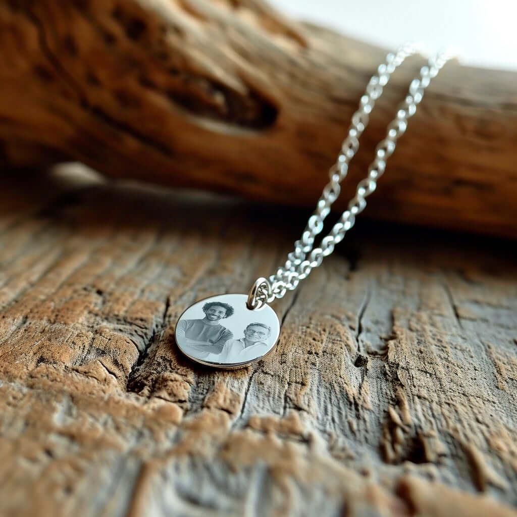 Personalized heart pendant in gold Photo Engraving with engraved photo, on a natural wood background