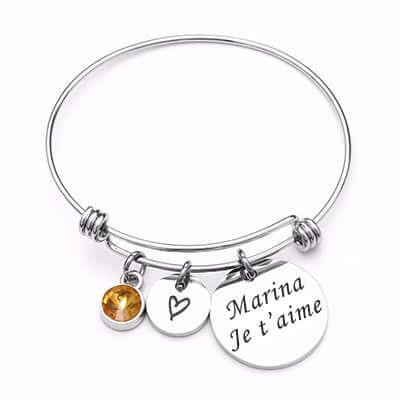 Personalized gold heart pendant Photo Engraving on bracelet, engraved 'Marina I love you'.