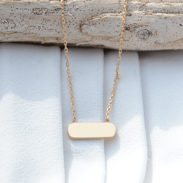 Barre en plaqué or avec son collier