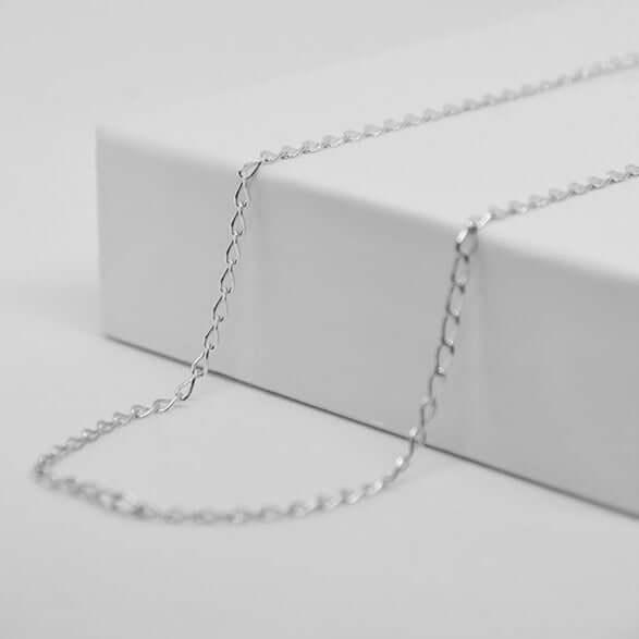 Fine silver chain for personalized heart pendant GravurePhoto, elegant jewelry on a white background.
