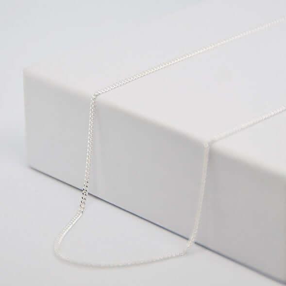 Fine silver GravurePhoto chain, presented on a white box, ready for personalized pendant.