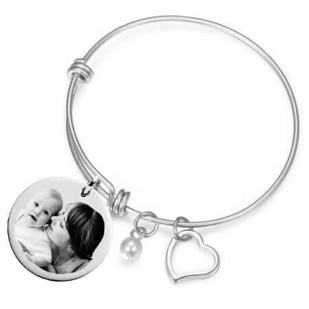 Bangle bracelet with personalized heart pendant in gold Photo engraving and engraved photo.