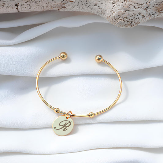 Open bangle with a medal - gold plated (drawing, text, pattern, photo)