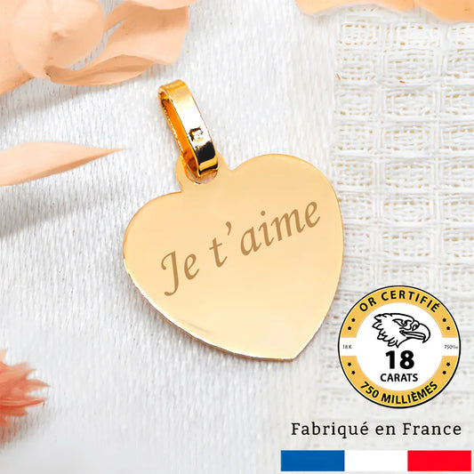 Médaille cœur en or 18 carats gravée avec 'Je t'aime', fabriquée en France.